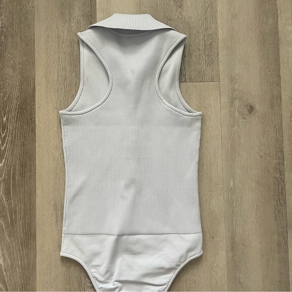 Tibi Ribbed Knit Button Snap Front Point Collared Polo Bodysuit in Light Blue - Picture 9 of 12